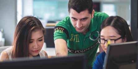 two women and one man on computer screen
